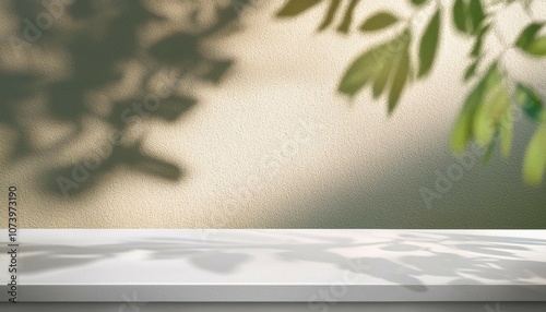 modern minimal empty cream white counter table top in sunlight tree leaf foliage shadow on wall for luxury organic fashion beauty cosmetic skincare body care product display background 3d