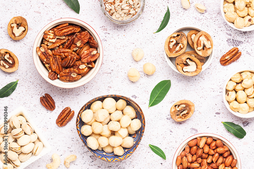 Assortment of fresh dry nuts and seeds on light marble background top view. healthy vegan food concept.
Assortment of fresh dry nuts and seeds on light marble background top view. healthy vegan food concept.