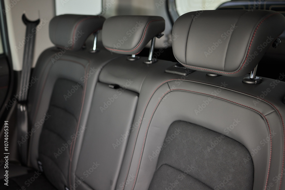 Obraz premium Car back seat with headrest and arm rest, a comfortable automotive fixture