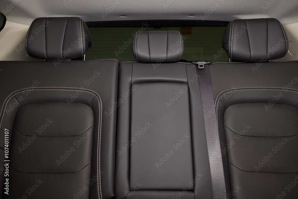 Car back seat with headrest and arm rest, a comfortable automotive fixture Car back seat with headrest and arm rest, a comfortable automotive fixture