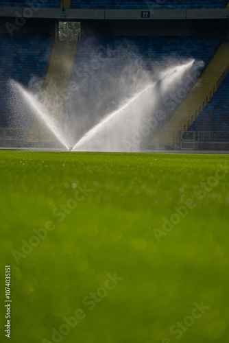 Obraz na płótnie sprinkler | watering the grass on the football pitch - special grass for playing football w salonie