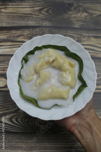 Semar Mendem Solo is a traditional Surakarta snack, made from glutinous rice and filled with shredded chicken in a thick coconut milk sauce. The outer layer is coated with flour and egg batter. photo