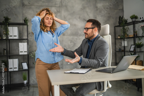 furious female colleague get angry while have discus with colleague photo