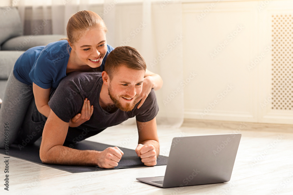 Sporty quarantine. Cheerful millennial couple training with personal fitness coach online, empty space Sporty quarantine. Cheerful millennial couple training with personal fitness coach online, empty space