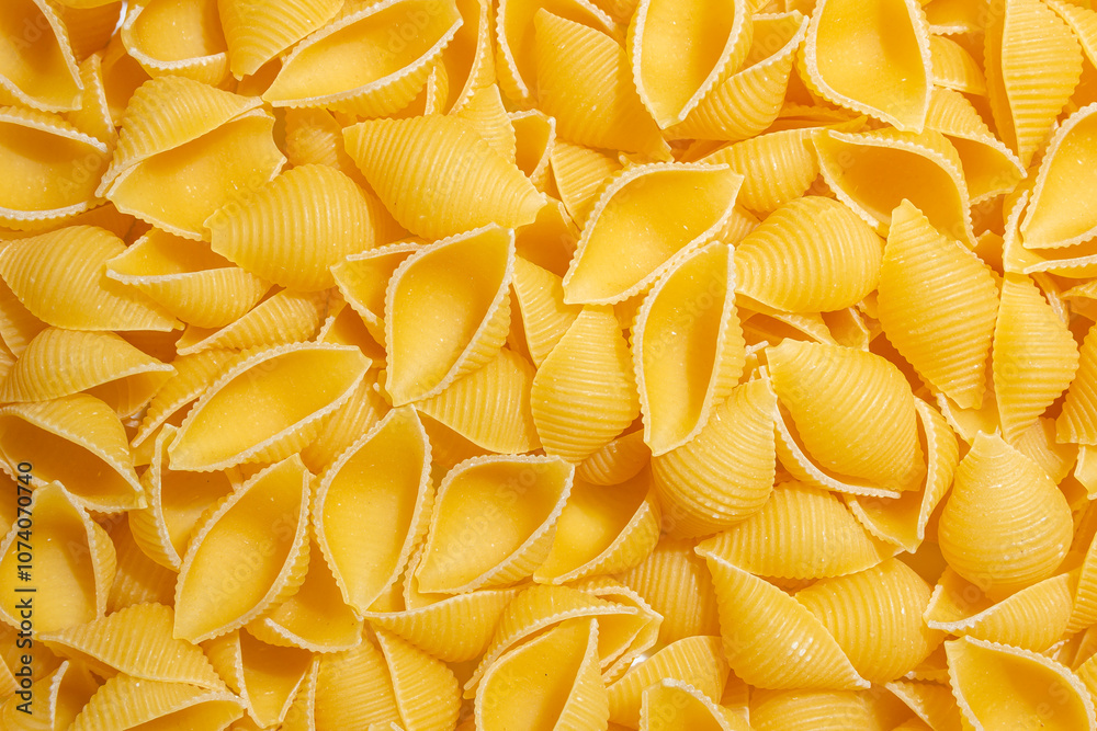 Uncooked Conchiglie Pasta: A Culinary Canvas of Conchiglie Macaroni, Creating a Lively and Textured Background for Gourmet Cooking. Dry Pasta. Raw Macaroni - Top View, Flat Lay Uncooked Conchiglie Pasta: A Culinary Canvas of Conchiglie Macaroni, Creating a Lively and Textured Background for Gourmet Cooking. Dry Pasta. Raw Macaroni - Top View, Flat Lay