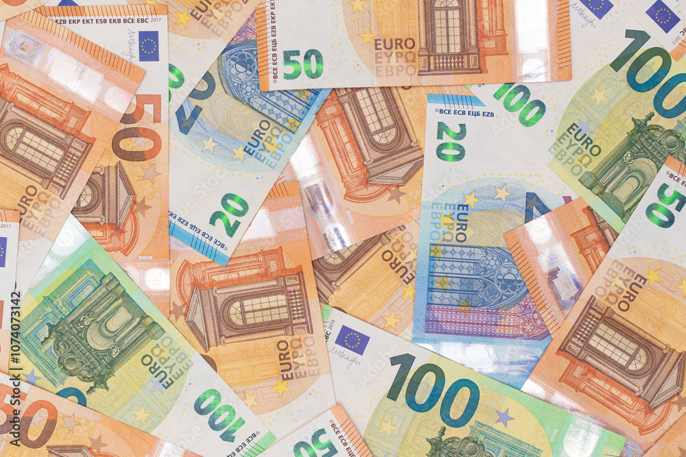 Different Euro Banknotes Money Background. Euro Money Currency. Colored Paper Money. A Lot of Fifty Euro Bills. Business, Finances, Cash and Money Saving Concept Different Euro Banknotes Money Background. Euro Money Currency. Colored Paper Money. A Lot of Fifty Euro Bills. Business, Finances, Cash and Money Saving Concept