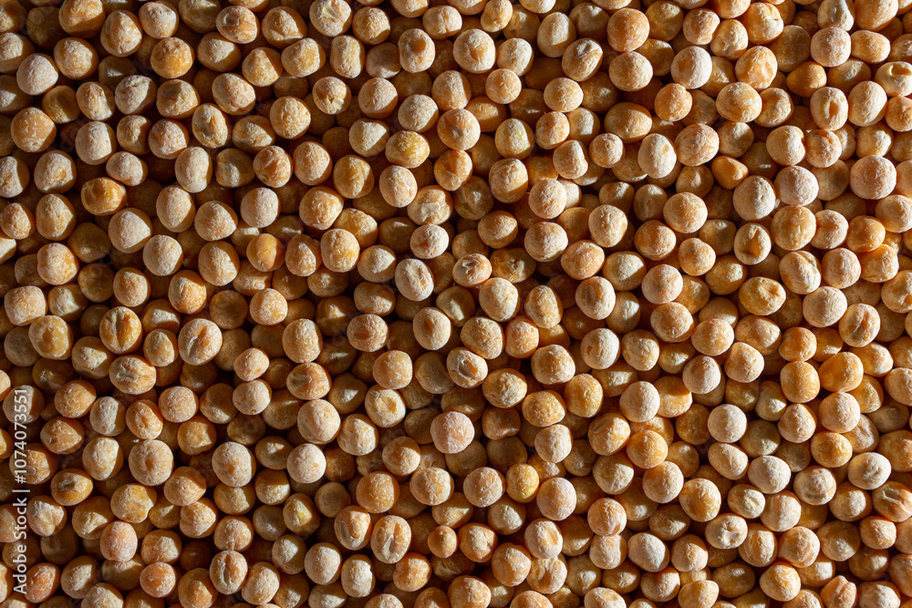 Uncooked Yellow Polished Peas Background. A Culinary Canvas of Dry Yellow Peas, Creating a Lively and Textured Background for Gourmet Cooking. Scattered Raw Polished Peas. Healthy Eating Ingredients Uncooked Yellow Polished Peas Background. A Culinary Canvas of Dry Yellow Peas, Creating a Lively and Textured Background for Gourmet Cooking. Scattered Raw Polished Peas. Healthy Eating Ingredients