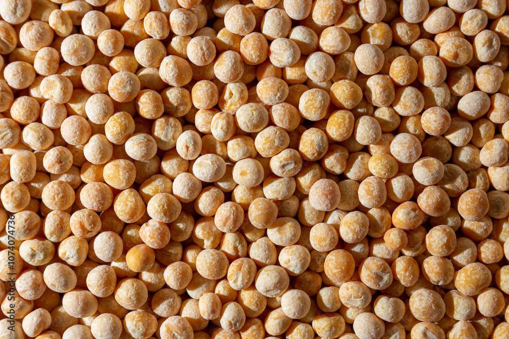 Uncooked Yellow Polished Peas Background. A Culinary Canvas of Dry Yellow Peas, Creating a Lively and Textured Background for Gourmet Cooking. Scattered Raw Polished Peas. Healthy Eating Ingredients Uncooked Yellow Polished Peas Background. A Culinary Canvas of Dry Yellow Peas, Creating a Lively and Textured Background for Gourmet Cooking. Scattered Raw Polished Peas. Healthy Eating Ingredients
