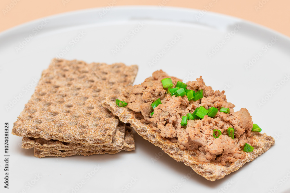 Crispy Sandwich with Chicken Pate and Green Onions on White Plate. Whole Grain Bread with Liver Pate. Diet Breakfast and Healthy Food Crispy Sandwich with Chicken Pate and Green Onions on White Plate. Whole Grain Bread with Liver Pate. Diet Breakfast and Healthy Food