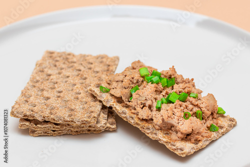 Crispy Sandwich with Chicken Pate and Green Onions on White Plate. Whole Grain Bread with Liver Pate. Diet Breakfast and Healthy Food