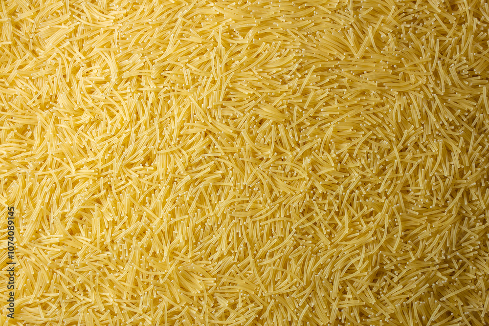 Uncooked Filini Pasta: A Culinary Canvas of Noodles, Creating a Lively and Textured Background for Gourmet Cooking. Dry Pasta. Raw Macaroni - Top View, Flat Lay Uncooked Filini Pasta: A Culinary Canvas of Noodles, Creating a Lively and Textured Background for Gourmet Cooking. Dry Pasta. Raw Macaroni - Top View, Flat Lay