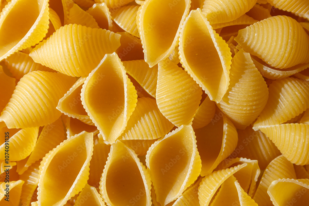 Uncooked Conchiglie Pasta: A Culinary Canvas of Conchiglie Macaroni, Creating a Lively and Textured Background for Gourmet Cooking. Dry Pasta. Raw Macaroni - Top View, Flat Lay Uncooked Conchiglie Pasta: A Culinary Canvas of Conchiglie Macaroni, Creating a Lively and Textured Background for Gourmet Cooking. Dry Pasta. Raw Macaroni - Top View, Flat Lay