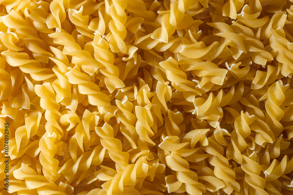Uncooked Fusilli Pasta: A Culinary Canvas of Spiral Macaroni, Creating a Lively and Textured Background for Gourmet Cooking. Dry Pasta. Raw Macaroni - Top View, Flat Lay Uncooked Fusilli Pasta: A Culinary Canvas of Spiral Macaroni, Creating a Lively and Textured Background for Gourmet Cooking. Dry Pasta. Raw Macaroni - Top View, Flat Lay