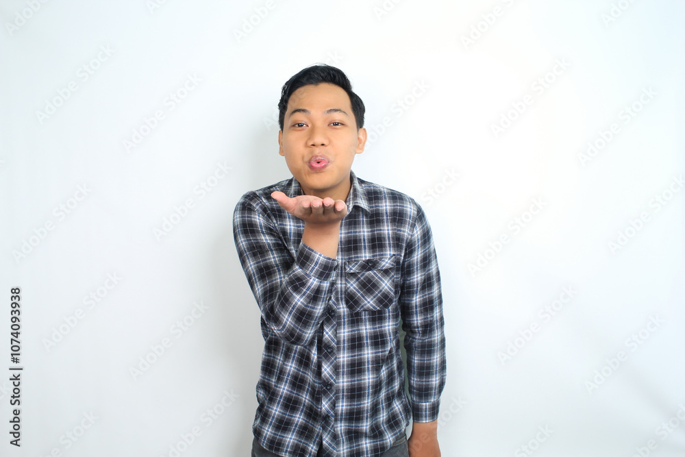happy asian man blowing kiss isolated on white background wearing casual shirt happy asian man blowing kiss isolated on white background wearing casual shirt