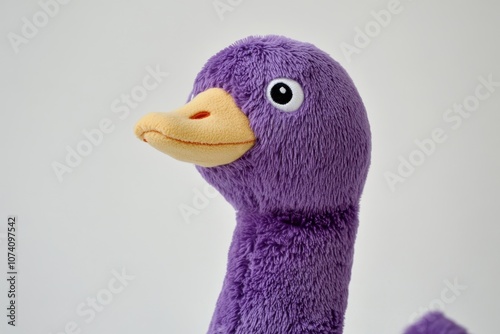 Cuddly purple goose toy on a white background Cute terry cloth adds appeal Ideal for children PlushToys Kids Goose Purple photo