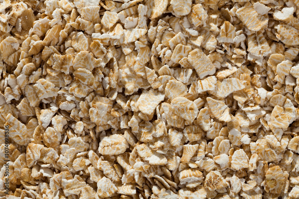 Closeup of oat flakes as background. Concept of healthy food.. Closeup of oat flakes as background. Concept of healthy food..