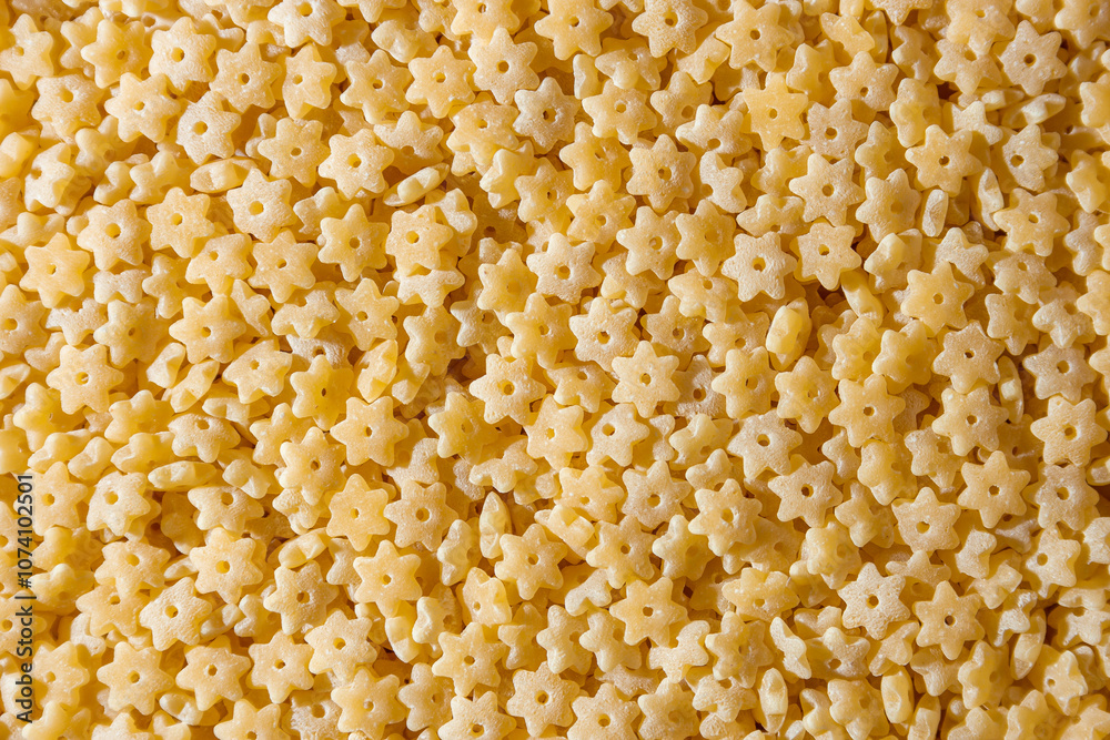 Uncooked Stelline Pasta: A Culinary Canvas of Stelline Macaroni, Creating a Lively and Textured Background for Gourmet Cooking. Dry Pasta. Raw Macaroni - Top View, Flat Lay Uncooked Stelline Pasta: A Culinary Canvas of Stelline Macaroni, Creating a Lively and Textured Background for Gourmet Cooking. Dry Pasta. Raw Macaroni - Top View, Flat Lay