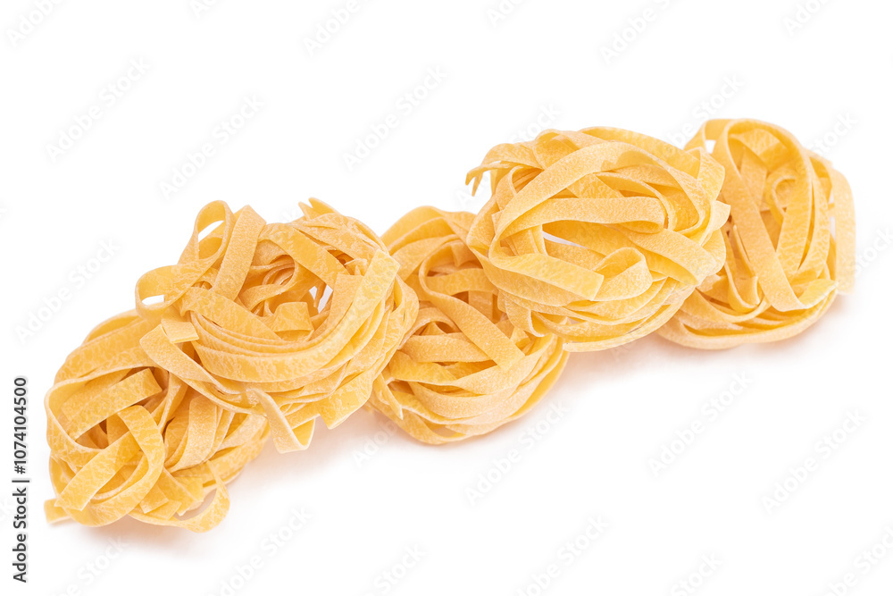 Five Classic Italian Raw Egg Fettuccine - Isolated on White Background. Dry Twisted Uncooked Pasta. Italian Culture and Cuisine. Raw Golden Macaroni Pattern - Isolation Five Classic Italian Raw Egg Fettuccine - Isolated on White Background. Dry Twisted Uncooked Pasta. Italian Culture and Cuisine. Raw Golden Macaroni Pattern - Isolation