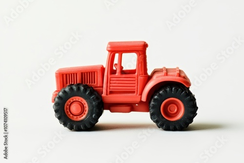 White background with red toy tractor