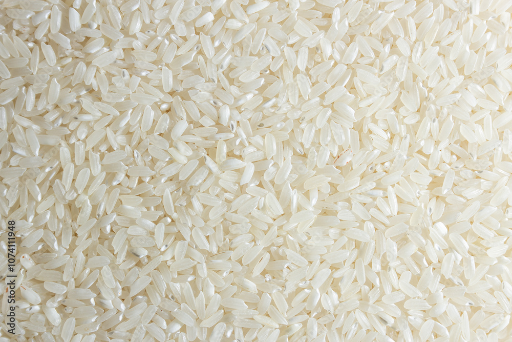 Dry Uncooked White Rice Background - Top View, Flat Lay. Scattered Raw Long Grain Rice. Asian Cuisine and Culture. Healthy Eating Ingredients. Diet Food Dry Uncooked White Rice Background - Top View, Flat Lay. Scattered Raw Long Grain Rice. Asian Cuisine and Culture. Healthy Eating Ingredients. Diet Food