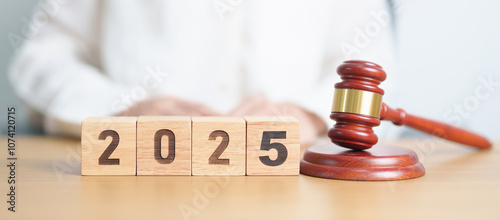 Happy New Year 2025 with judge gavel on table. Law, lawyer, judgment, justice auction and bidding concept photo