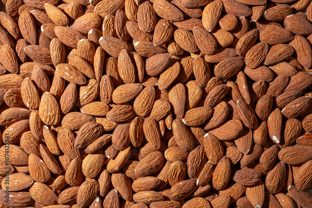 Scattered Almonds. Background from Almond Nuts. Natural High-Calorie Snacks Scattered Almonds. Background from Almond Nuts. Natural High-Calorie Snacks
