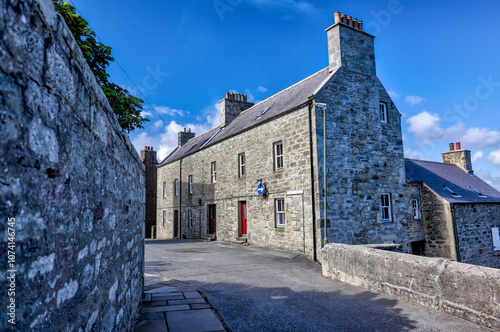 Fotografija Lerwick, Shetland Islands: - August 14, 2024: Buildings along the shores of Lerw