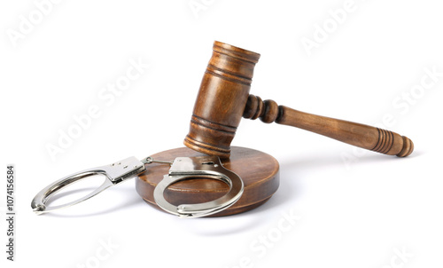 Handcuffs and judge's gavel isolated on white