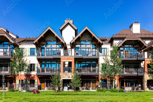 Vail Colorado lodge hotel condo building of European Swiss style ski resort town, apartment building with balcony in summer photo