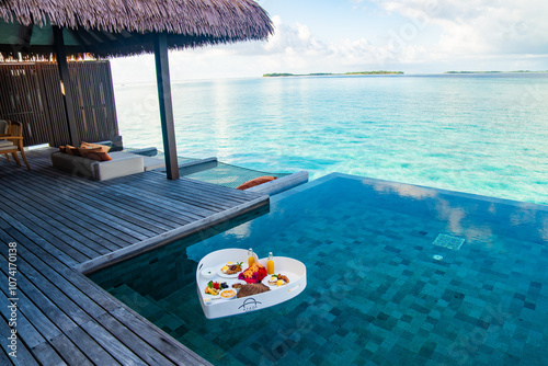 Fototapeta Naklejka Na Ścianę i Meble -  Floating breakfast in a heart shape in the pool in Maldives