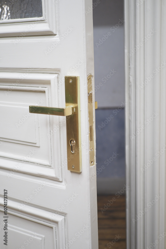 An Elegant Open Door Featuring a Beautiful Brass Handle Bathed in Soft Lighting Atmosphere An Elegant Open Door Featuring a Beautiful Brass Handle Bathed in Soft Lighting Atmosphere