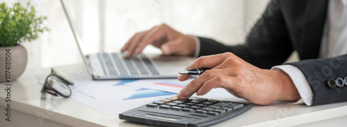 Banner Asian Business man hands using calculator counting tax financial bill. Tax audit Finacial concept. Panorama Close up businessman hands calculating number tax audit planning with copy space photo
