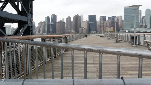 New York City waterfront skyline, Manhattan Midtown buildings, riverfront skyscrapers by East river water. Waterside cityscape view, Gantry Plaza pier, Long Island, Queens. United States architecture.