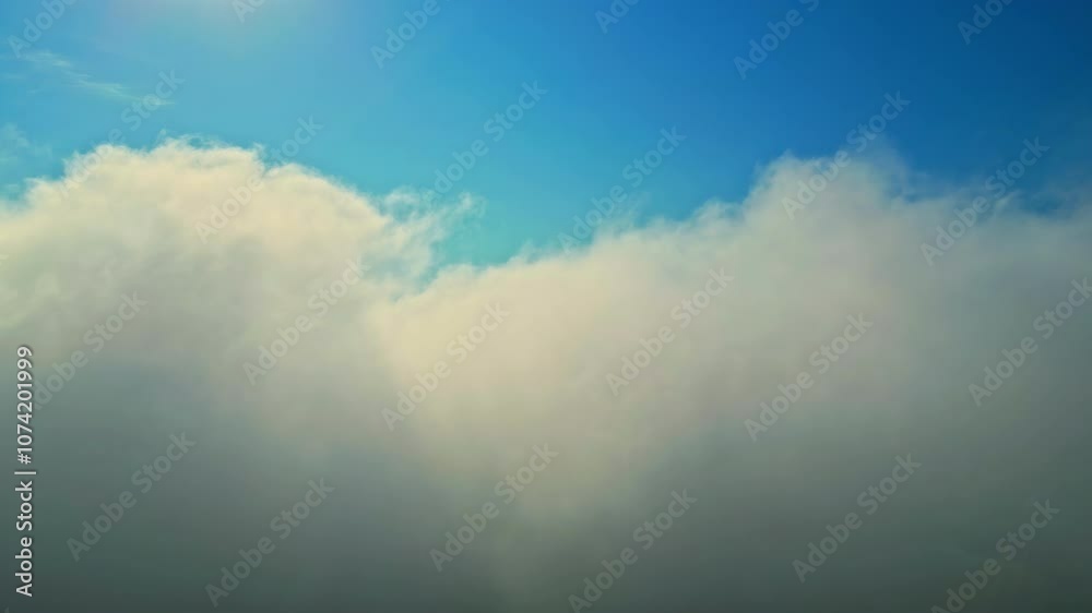 Flying through clouds towards the blue heavens - push forward view Flying through clouds towards the blue heavens - push forward view