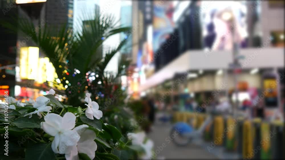 New York City Times Square, Manhattan Midtown Broadway street, USA. American NYC urban life. Defocused people pedestrians. Advertising signs, commercial ads, illuminated billboard screens, greenery. New York City Times Square, Manhattan Midtown Broadway street, USA. American NYC urban life. Defocused people pedestrians. Advertising signs, commercial ads, illuminated billboard screens, greenery.
