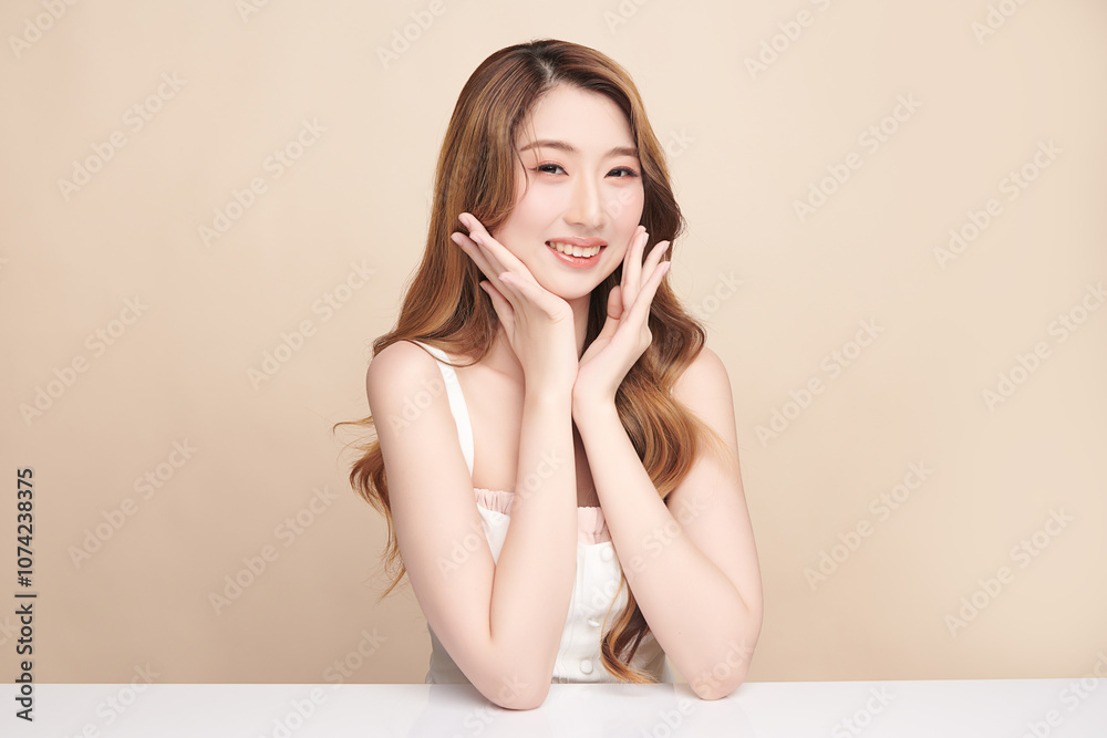 Beautiful young asian woman with clean fresh skin on beige background, Face care, Facial treatment, Cosmetology, beauty and spa, Asian women portrait. Beautiful young asian woman with clean fresh skin on beige background, Face care, Facial treatment, Cosmetology, beauty and spa, Asian women portrait.