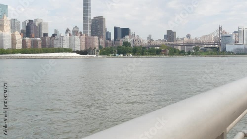 New York City waterfront skyline, Manhattan Midtown buildings, riverfront skyscrapers, East river. Waterside cityscape from Gantry Plaza Park, Long Island, Queens, United States. Queensboro Bridge. photo