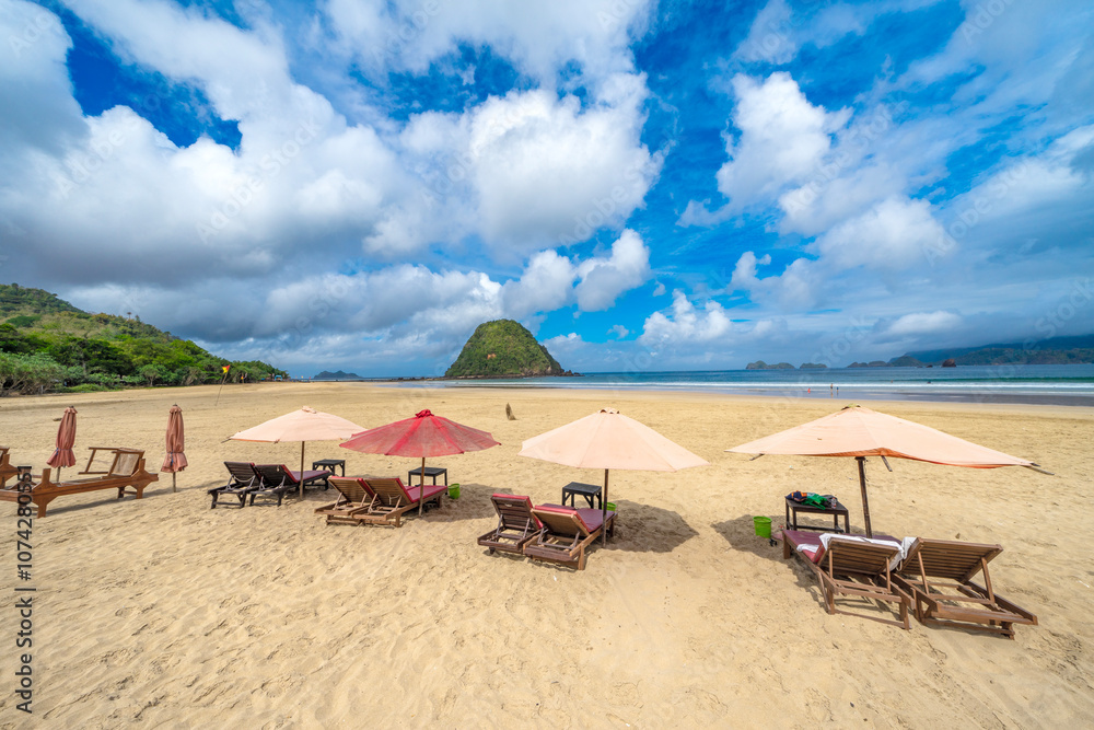 Beautiful tropical beach on Red Island (Pulau Merah) coast Beautiful tropical beach on Red Island (Pulau Merah) coast