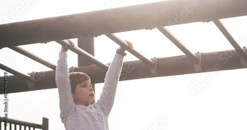 Canvas Print Boy, child and park on monkey bars at playground, swing or adventure for lifting, learning or balance