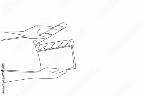 Single one line drawing the hand is holding an open clapper. Filmmaking process. Useful tool for film editors. Synchronization. National Screenwriters Day. Continuous line design graphic illustration