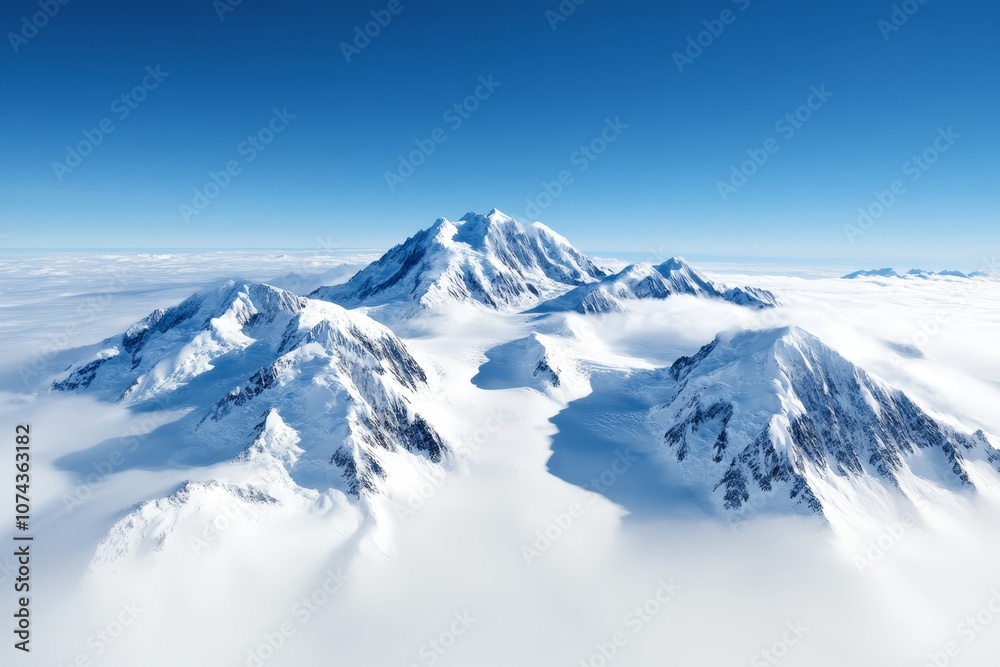 A view of a mountain range covered in snow and clouds A view of a mountain range covered in snow and clouds