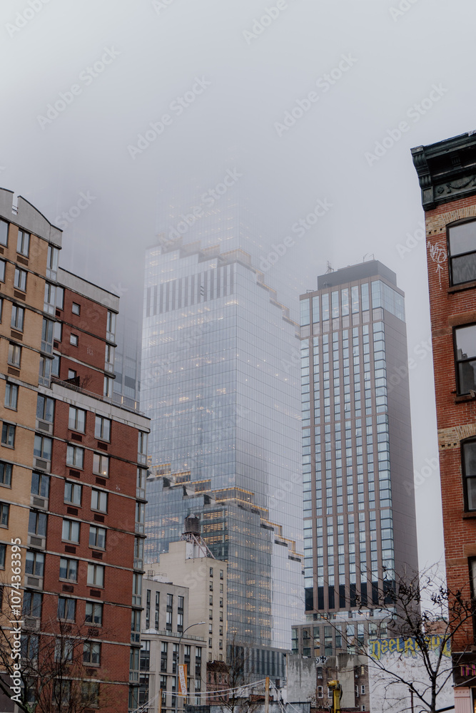 Fototapeta premium Foggy Cityscape Blend Where the Urban Jungle Meets Misty Skyline Inviting Wonder