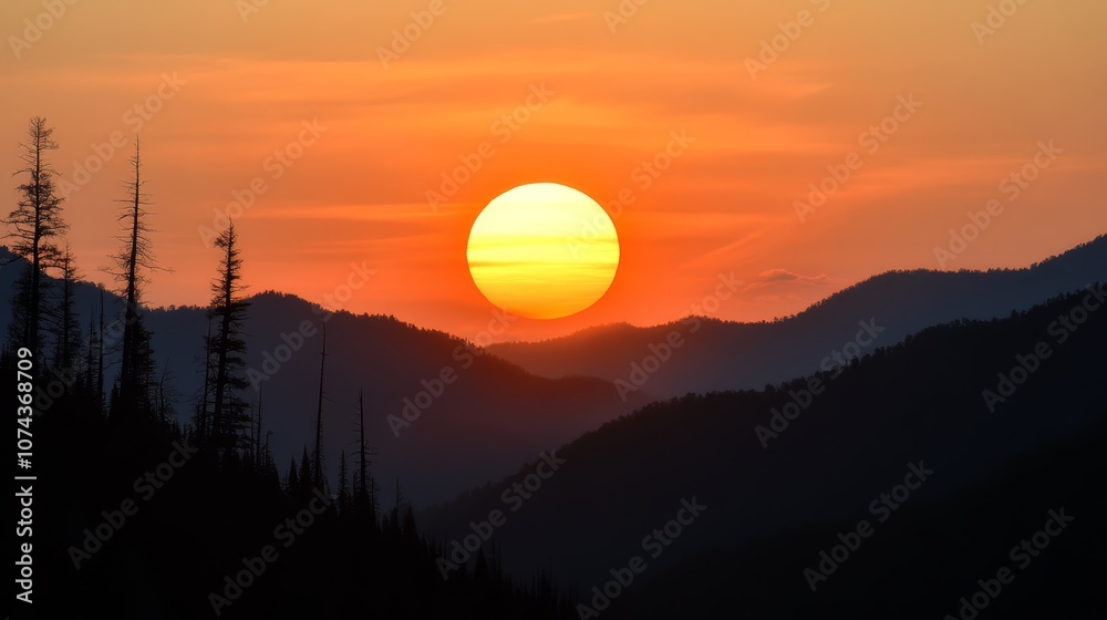 A sunset over a mountain range with trees in the foreground A sunset over a mountain range with trees in the foreground