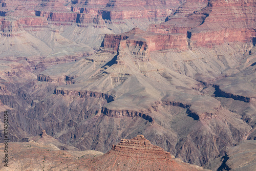 Midday views at some spectacular geological formations, red, pink, orange colorful cliffs and rocks from South Rim at Grand Canyon National Park, Arizona. High quality picture for download. photo