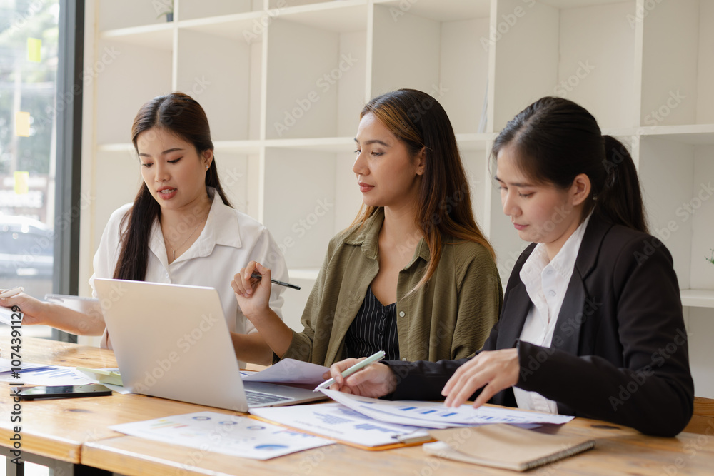 Asian businesswoman teamwork working on laptop with finances analysis report at desk in office, business financing, accounting banking, Team of creative and business planning, Asian businesswoman teamwork working on laptop with finances analysis report at desk in office, business financing, accounting banking, Team of creative and business planning,