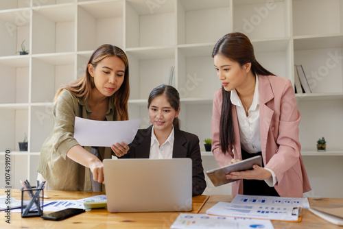 Asian businesswoman teamwork working on laptop with finances analysis report at desk in office, business financing, accounting banking, Team of creative and business planning, 