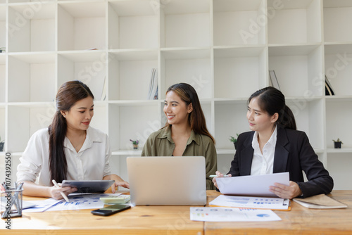 Asian businesswoman teamwork working on laptop with finances analysis report at desk in office, business financing, accounting banking, Team of creative and business planning, 