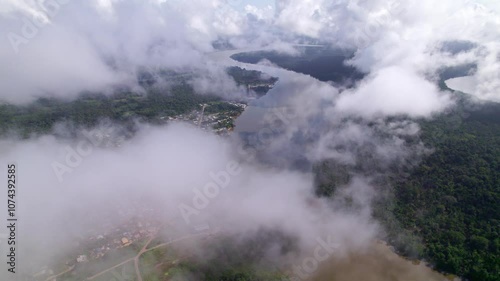 Clouds view of rural residential area alongside the river, South America, Suriname photo