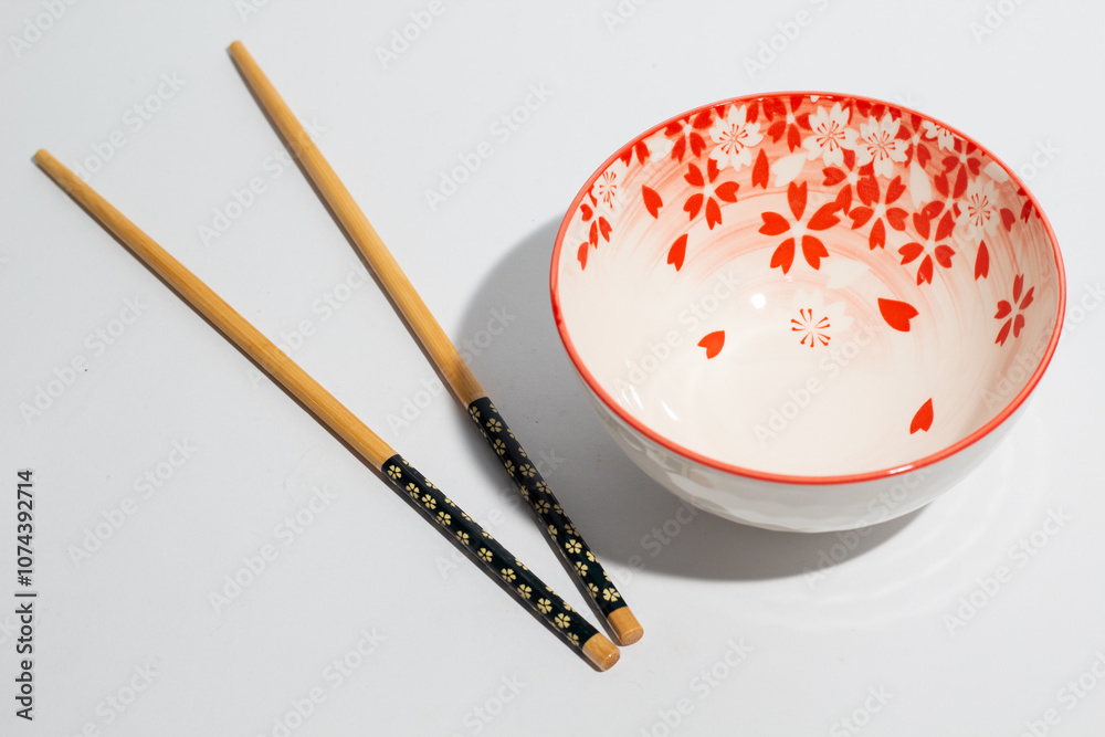 Floral pattern of chinese bowl and chopsticks on white background Floral pattern of chinese bowl and chopsticks on white background