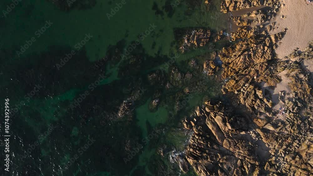 rocky seashore beach with calm sea waves, drone view from top with movement rocky seashore beach with calm sea waves, drone view from top with movement